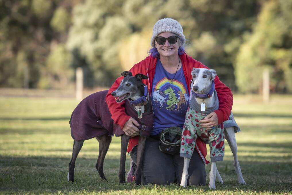 Trudy Hills and her adopted greyhounds at Heritage Forest. Pictures: Craig George