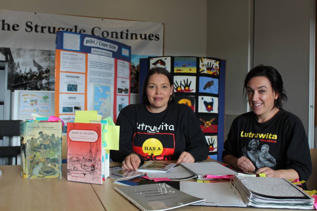 Language researcher Rosetta Thomas and youth worker Daisy Allan with manuscripts. Picture: Adam Holmes