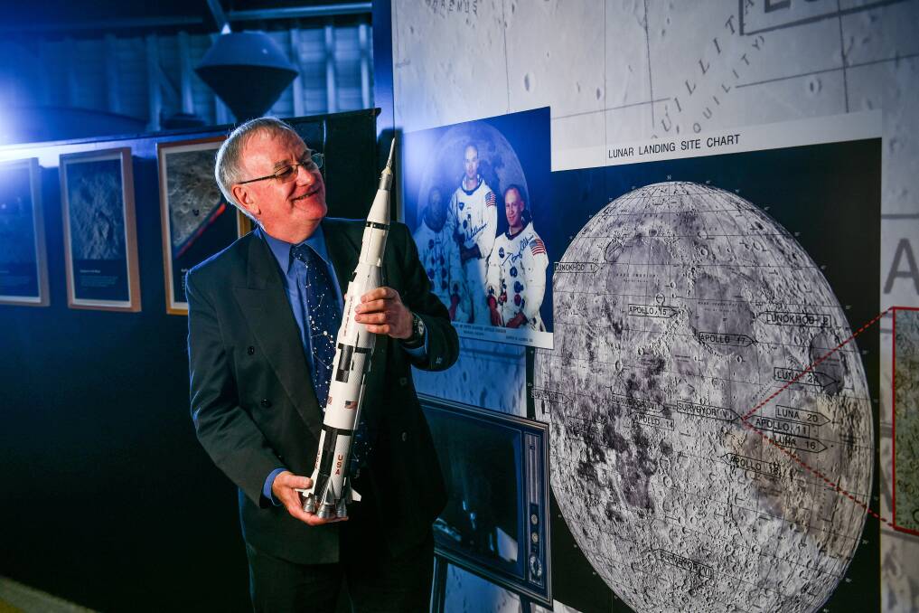 Launceston Planetarium astronomer curator Martin George with a scale model of the Saturn V rocket used in the Apollo missions. He will speak at a Winter Relief event at Star Theatre. Picture: Scott Gelston