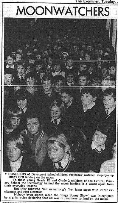 The Examiner, July 22 1969. Devonport children crowd in for the historic moment.