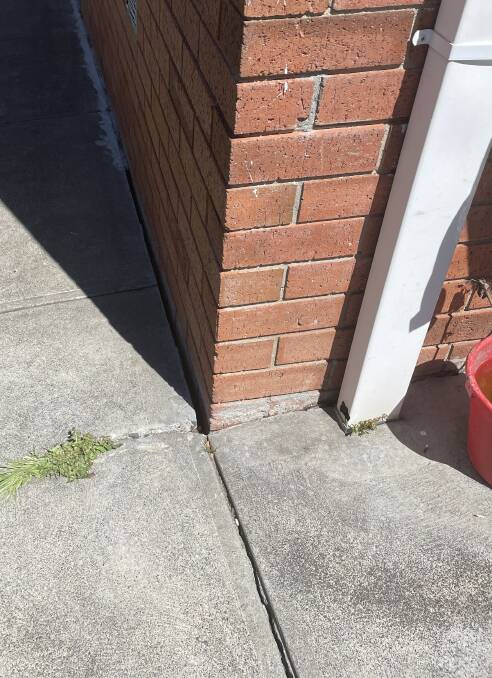 Significant cracks and warping of concrete have appeared at the corners of Bev Bilac's house. Picture: Adam Holmes