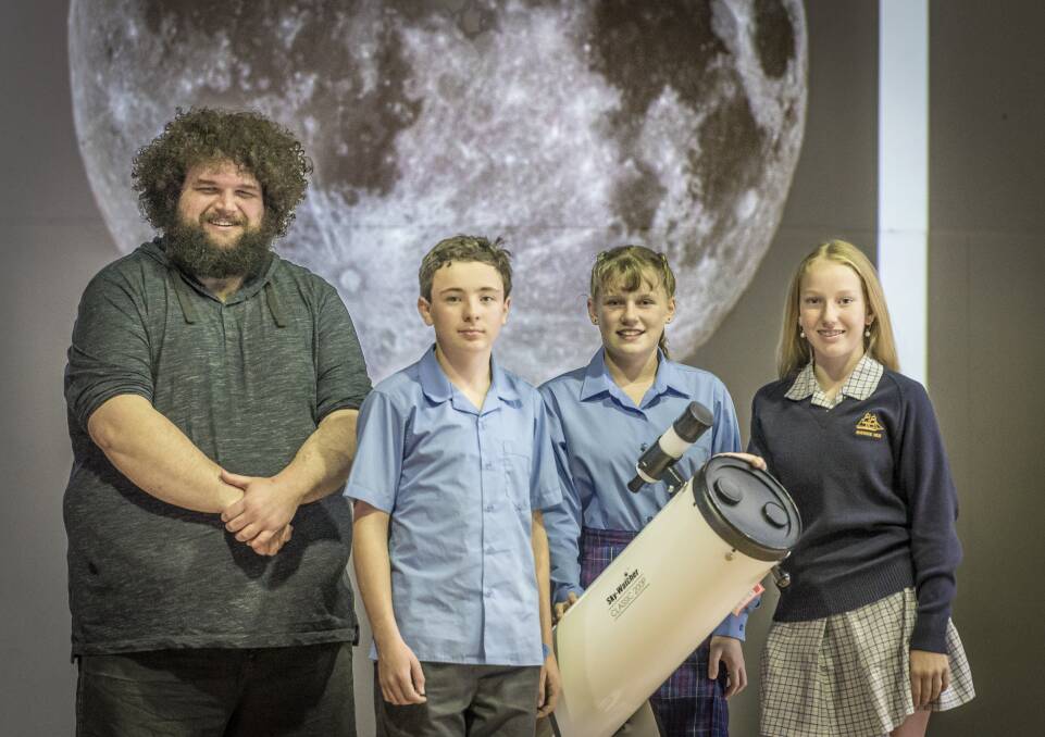 Peter Swanton, from the ANU's Tjabal Indigenous Higher Education Centre, with Riverside High School grade seven students Nathan Pearce, Emma Johnstone and Jordan Hodge. Picture: Craig George