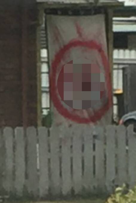 One of the Nazi Swastikas hanging from a house in Perth. The Examiner has pixellated the image in order to reduce distress for members of the Jewish community. Image: supplied