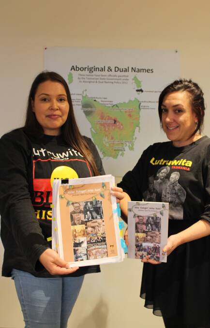 TAC language and youth workers Rosetta Thomas and Daisy Allan with the new palawa kani dictionary, and last edition from 2013. Picture: Adam Holmes