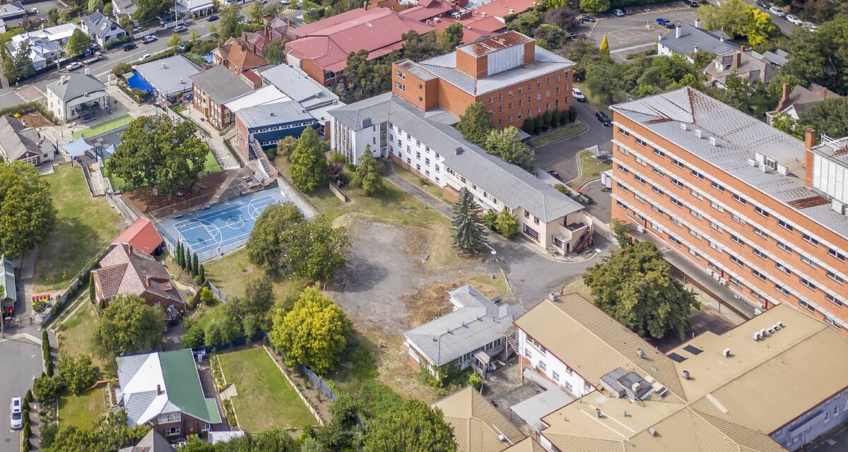The block of land includes the former tennis court area, pictured in grey, the three-storey white building which was the former nurses' quarters and the surrounding green space. Picture: Craig George