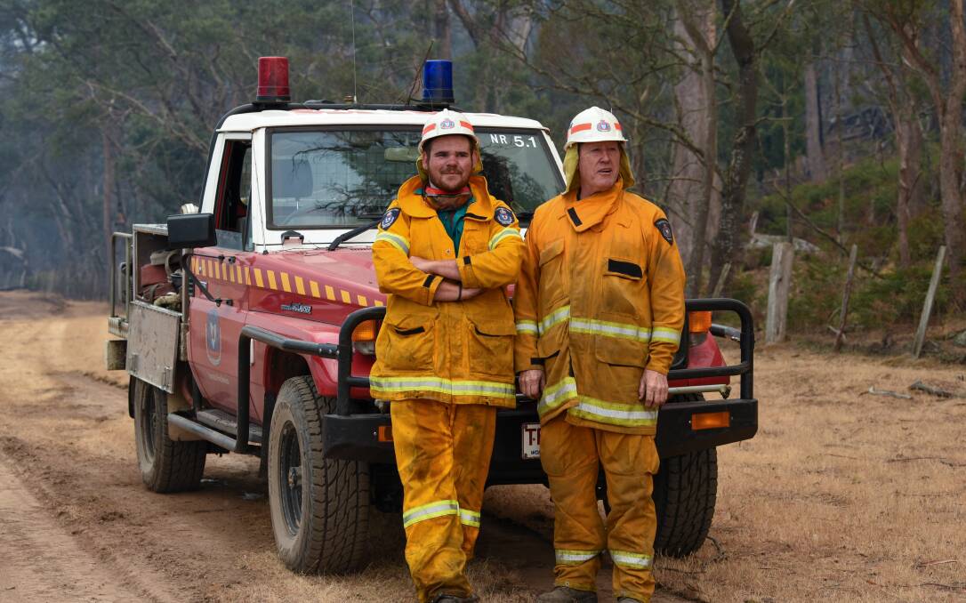 Volunteer firefighters Alex Johns and Paul Southworth battle the fires at Malahide Estate north of the Fingal township. Picture: Neil Richardson