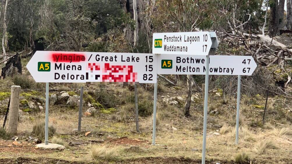 The sign on Highland Lakes Road east of Miena which was spray painted with a racist slur against Aboriginal people. The Examiner has chosen to blur the words. Picture: Sally Gill, Twitter