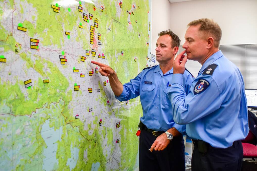 TFS acting district officer Rob Mahnken and district officer James Newstead assess fire threats at Youngtown on Saturday. Picture: Neil Richardson