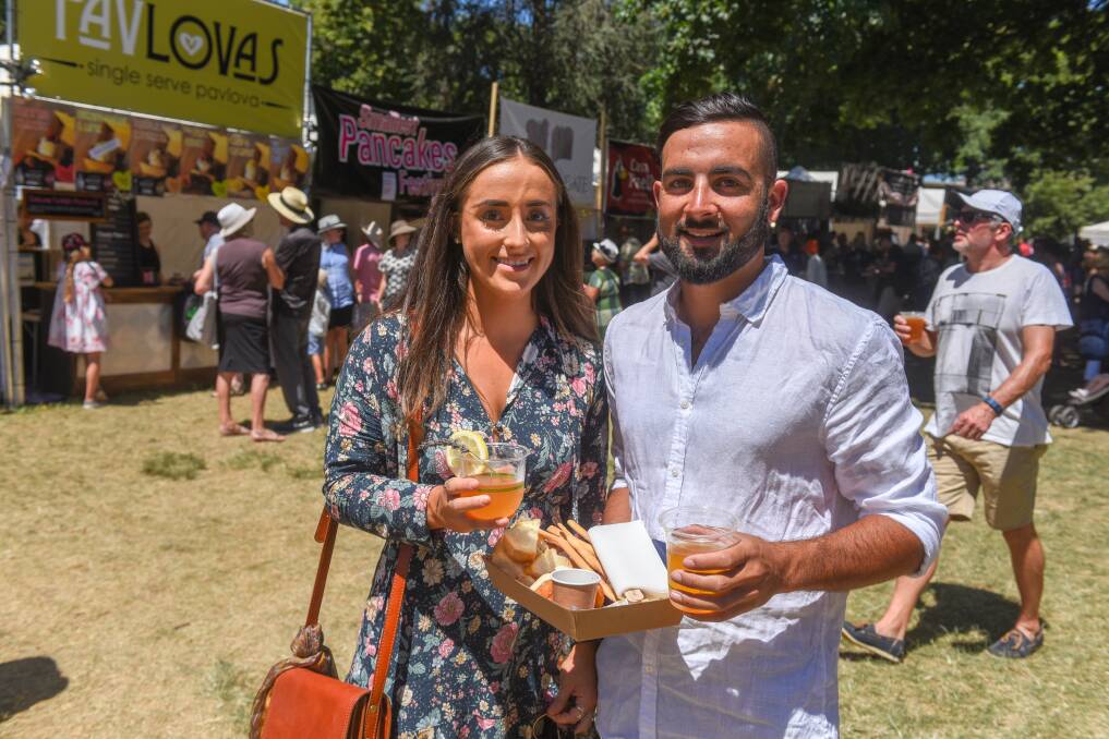 Lauren Duff and Kiran Overton sample some of the produce on offer at Festivale on Sunday. Picture: Paul Scambler