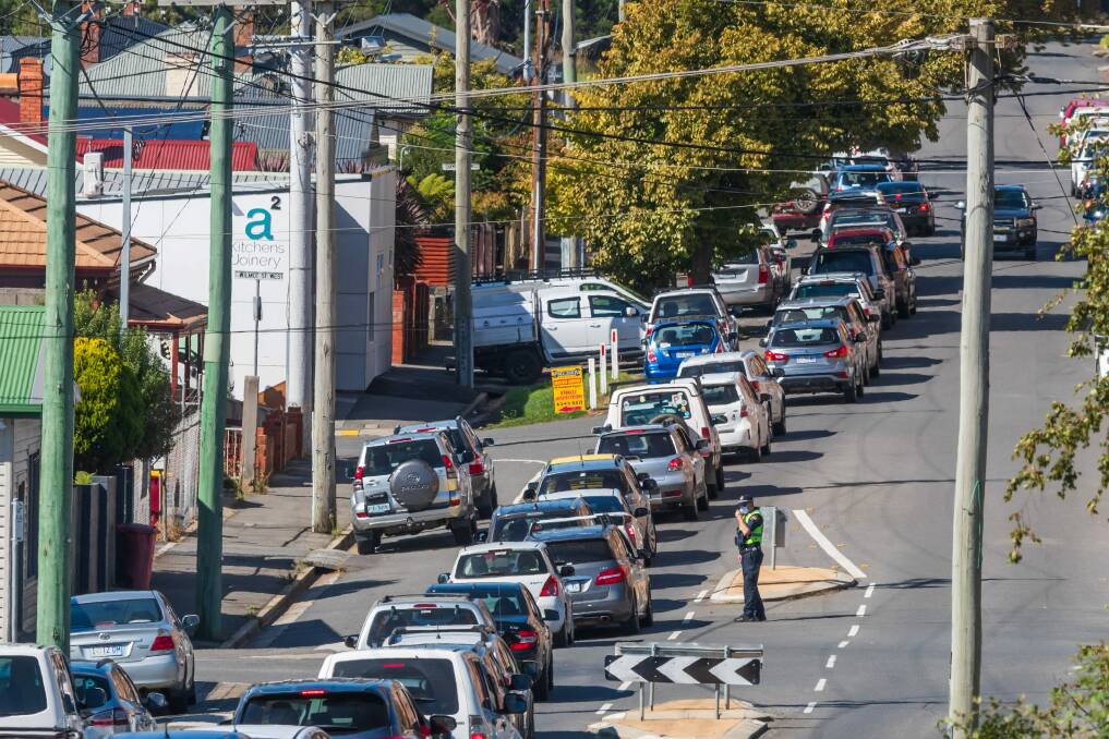A long line forms at a COVID testing centre in Launceston in March. Labor is concerned about potential delays when testing is required for all interstate travel. Picture: Phillip Biggs