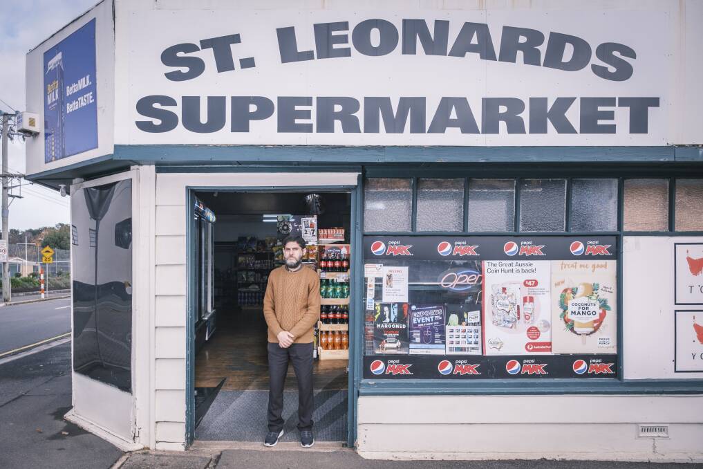 Owner of St Leonards Supermarket and Newsagency, Mian Ahmad, says the armed robbery left his family shaken. Picture: Craig George