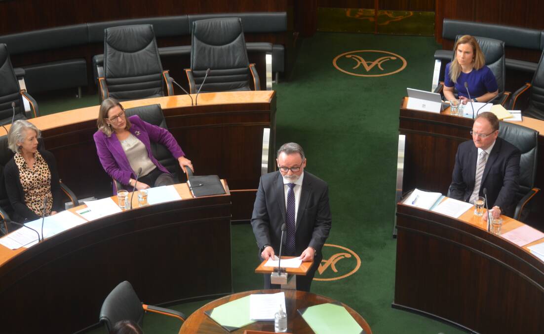 David O'Byrne addresses parliament at the start of question time. Independent Kristie Johnston (back, right) later raised further allegations of sexual harassment against Mr O'Byrne. Picture: Matt Maloney