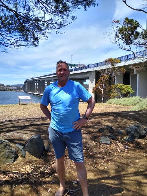 Ross after completing the Derwent River swim from New Norfolk to the Tasman Bridge. Picture: Christopher Guesdon