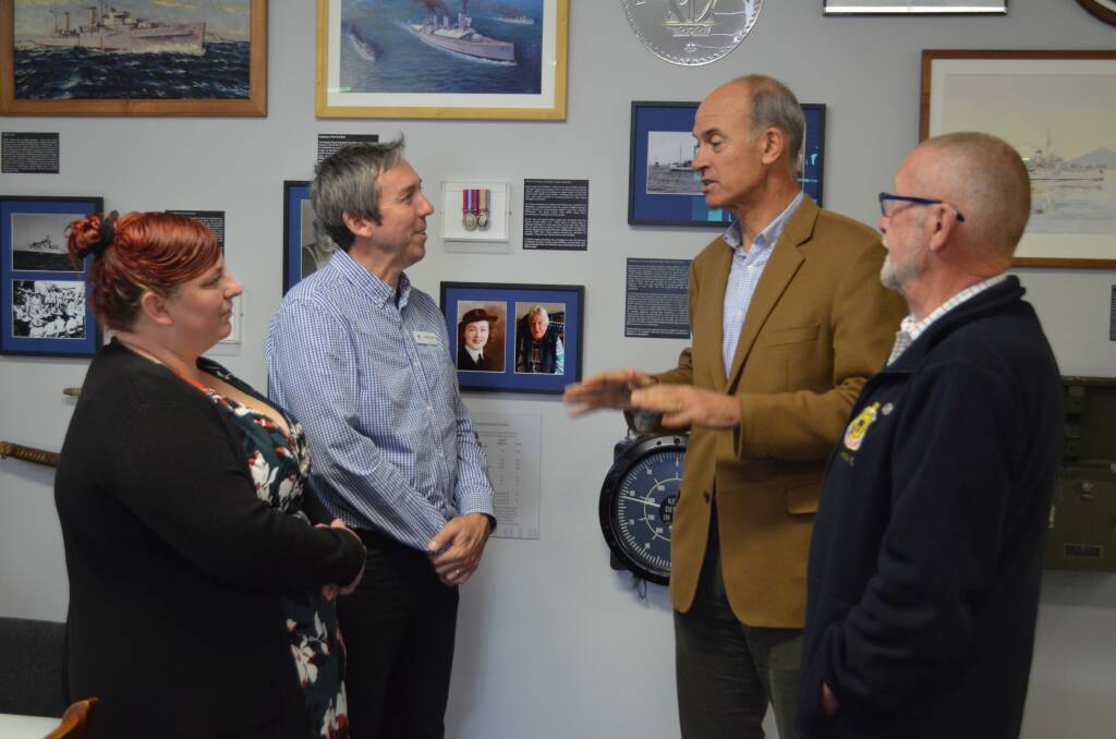 Energy Minister Guy Barnett discusses the power bill cut with Jessica Berger from George Town Neighbourhood House, John Hooper from NILS Tasmania and Graeme Barnett from Launceston RSL. Picture: Adam Holmes