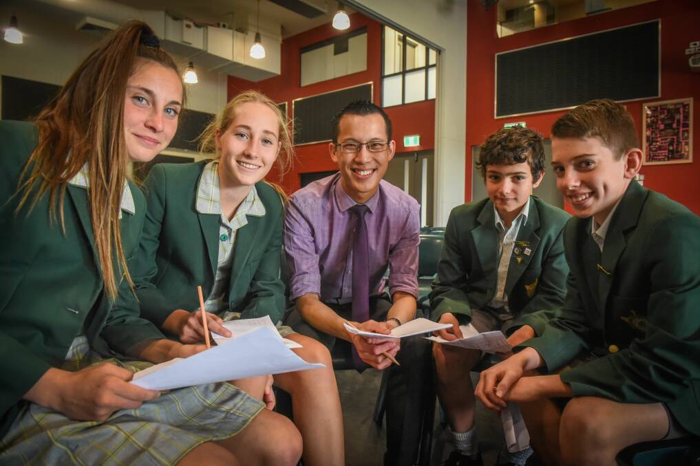 St Patrick's students Isabella Davie, Clea Embury, Xavier Duffy and Cameron Cook with teacher Eddie Woo. Picture: Paul Scambler