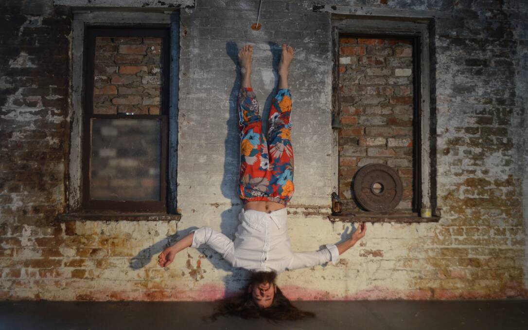 Gabriel Comerford uses his dance abilities to get a greater feel of the old bakery above St John Craft Beer Bar as he prepares for the Junction Festival. Picture: Adam Holmes