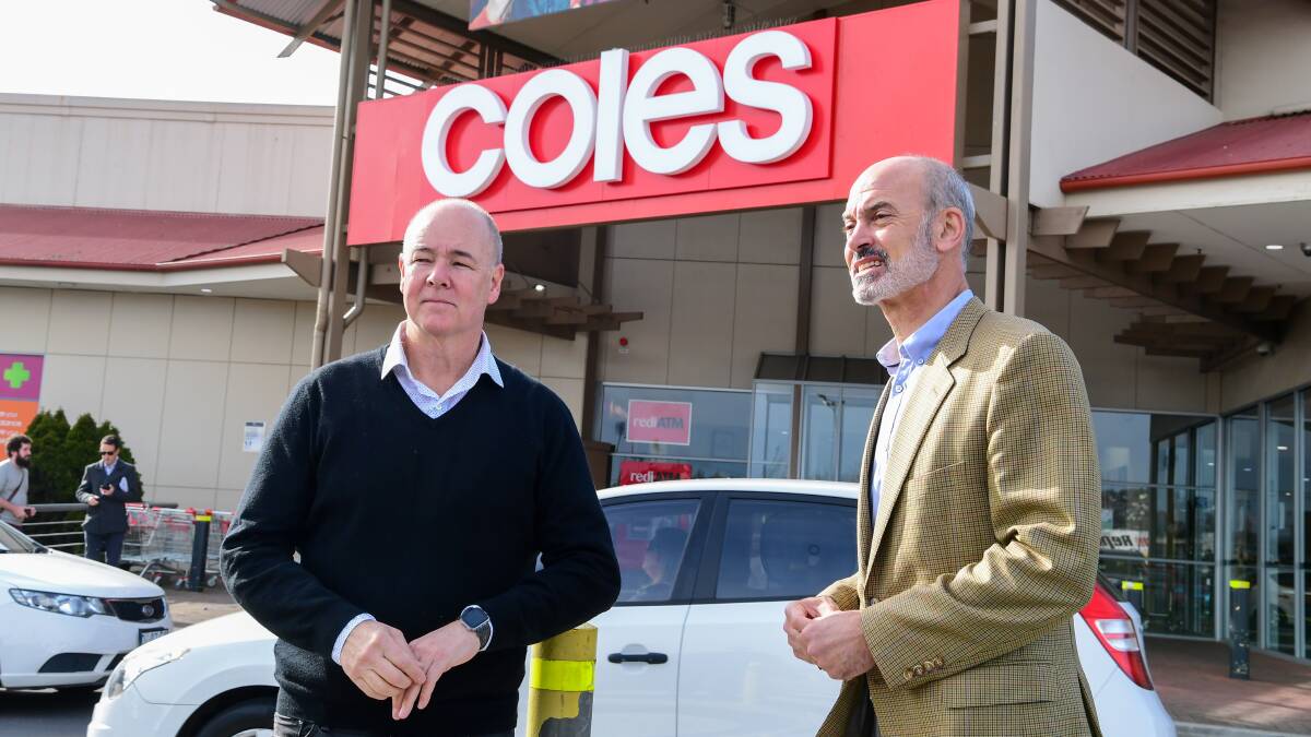 Launceston Chamber of Commerce executive officer David Peach with Energy Minister Guy Barnett outside Coles in Launceston. Picture: Neil Richardson