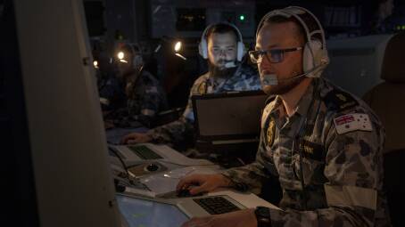 Cybersecurity: Combat systems operator Michael Curry monitors his console onboard HMAS Toowoomba. Picture: Department of Defence 