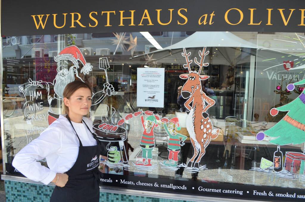 Last supper: Wursthaus employee Isabel Johnson at the storefront of Wursthaus Kitchen Launceston. Picture: Harry Murtough