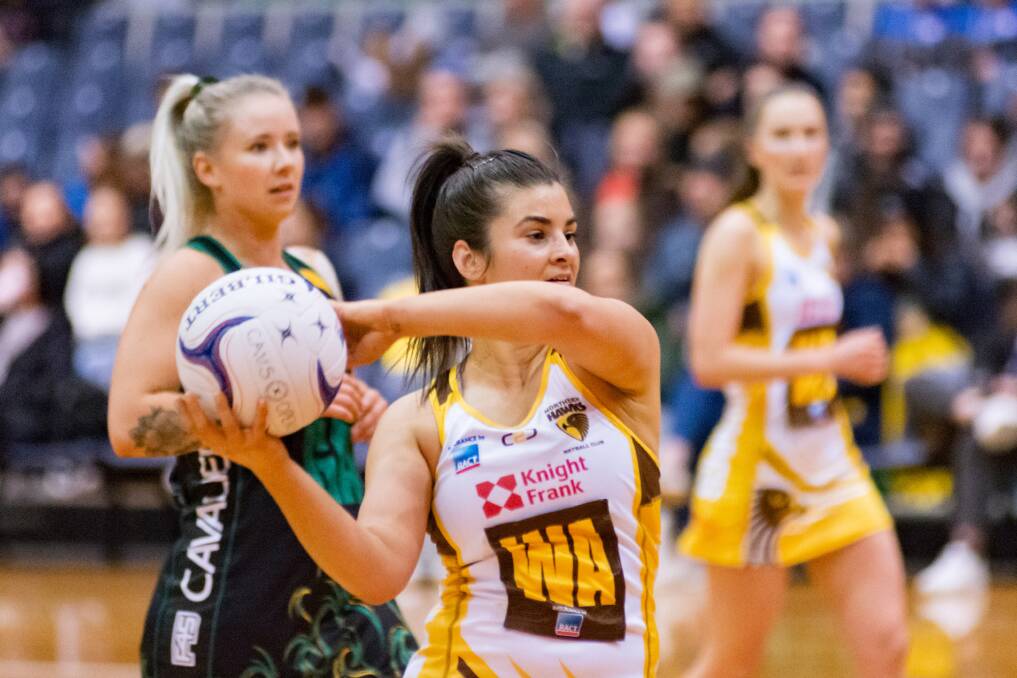 SUPREMACY: Cavs goal attack Zoe Claridge behind Hawks wing attack Steph Walker during the last Silverdome match. Picture: Phillip Biggs