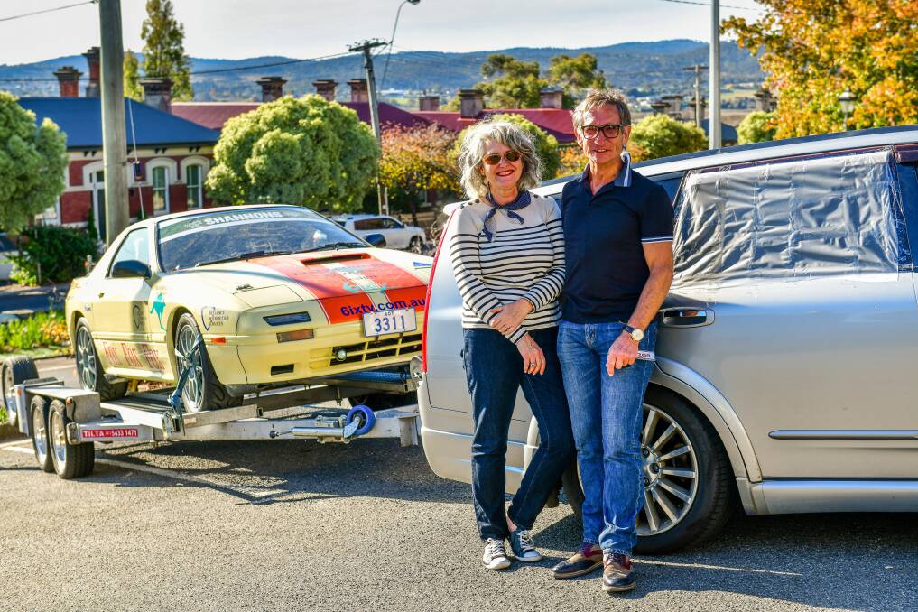 undeterred: ACT couple Therezia Mihajlovic and Barry Faux with their 1985 Mazda ZX7 and tow-car, which was broken into Tuesday morning. Picture: Scott Gelston