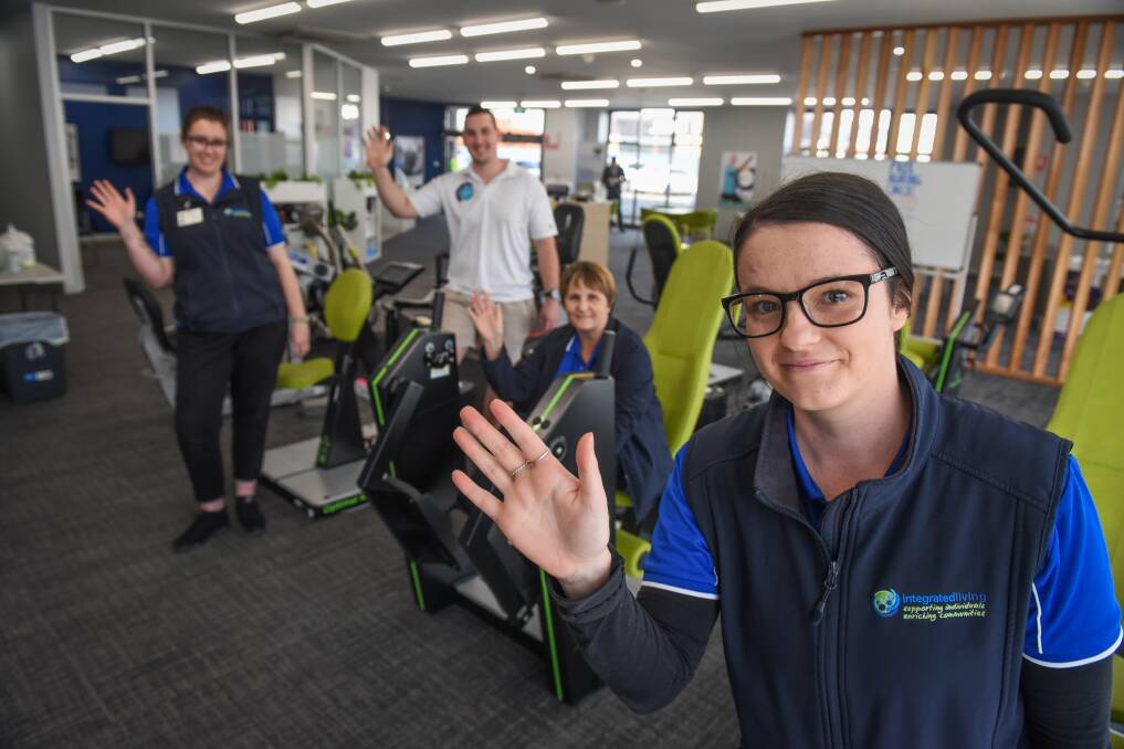 WAVING: integratedliving's Lauren Mitchell, gives a wave with Cassie Bailey , Exercise Physiologist Matthew Fulton, Robyn Dabner. Picture: Paul Scambler