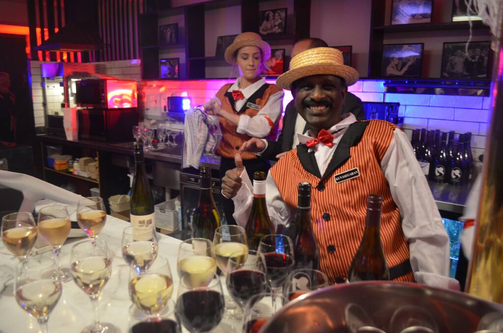 Drink up: The sharply dressed Kuna Kunasegaran pouring wine for tourism operators at the Gala evening. Picture: Harry Murtough