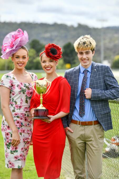 Shining: Sorayah Woods in an outfit from Kachoo, Launceston Cup Ambassador Chelsea Freestone in an outfit from Sharee Marshall and Ash Carroll in an outfit from Myer, with the 2020 Launceston Cup. Picture: Scott Gelston