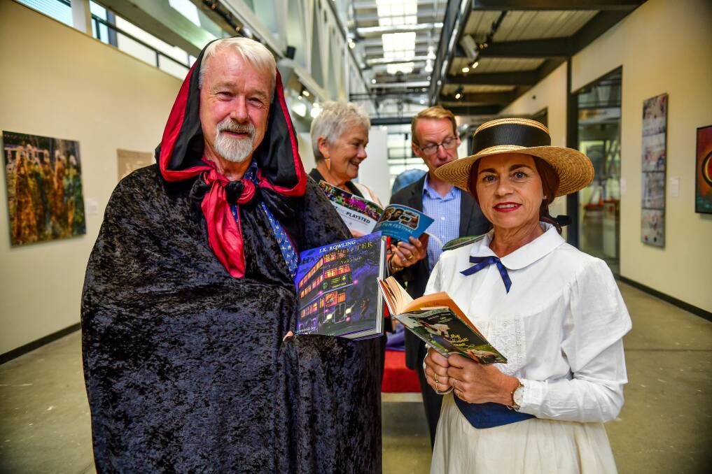 BOFA's Owen Tilbury and Gina McKenzie look their part in Book Week costumes as Helen Tilbury and Academy Gallery director Malcolm Bywaters look at the program for this year's event. Picture: Scott Gelston 