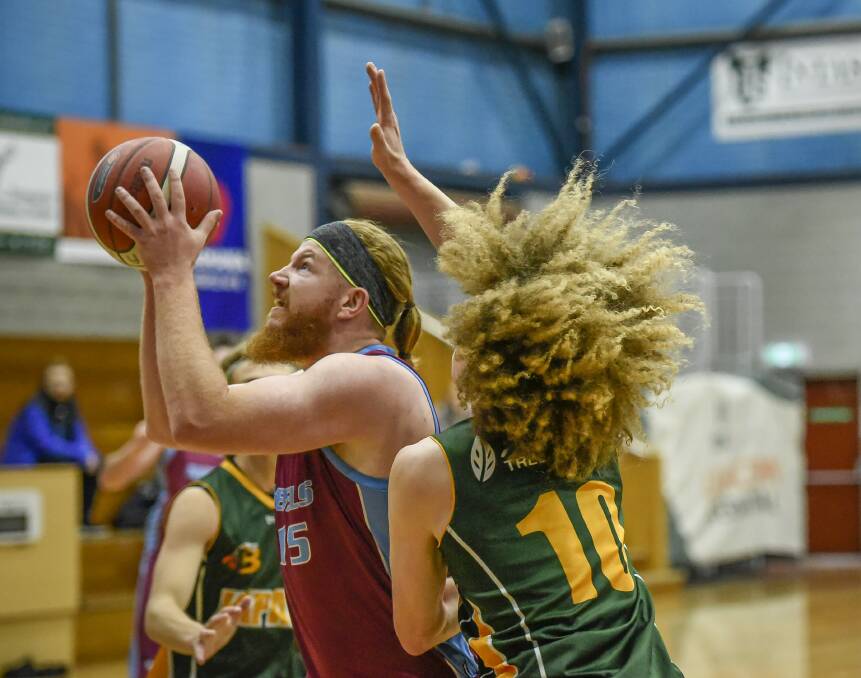 JUMPER: Rebels centre Hugh King joined his team in a high-scoring affair with 16 points. Picture: Craig George
