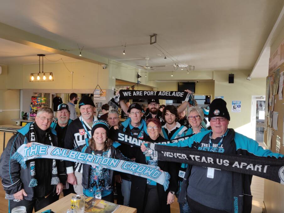 Power fever: Port Adelaide fans gathered at the Invermay Tavern for a pint before the game against the Hawks. Picture: Harry Murtough