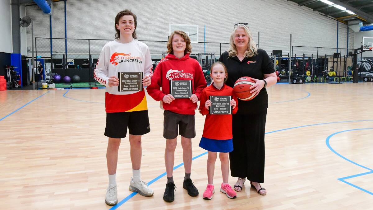 Family Champs: Aiden Gibson 15, Cassidy Gibson, 9 and Logan Gibson, 13 with coach and mum Mandy Gibson. Picture: Neil Richardson