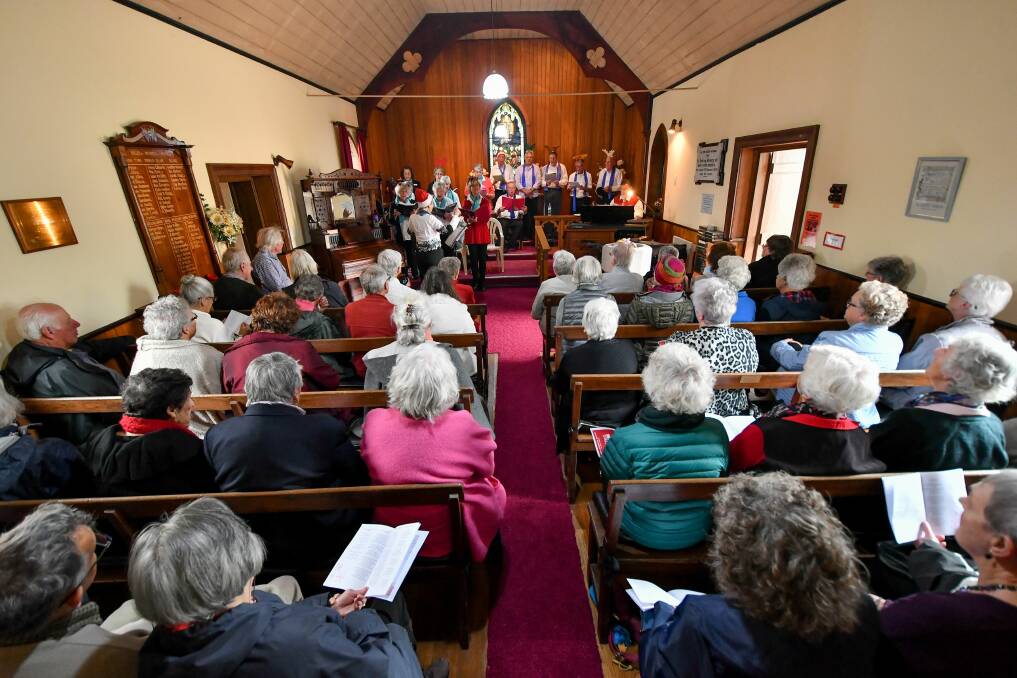 Deck the halls: The annual Franklin House Christmas carols and cake were moved intdoors to St James Anglican Church. Picture: Scott Gelston