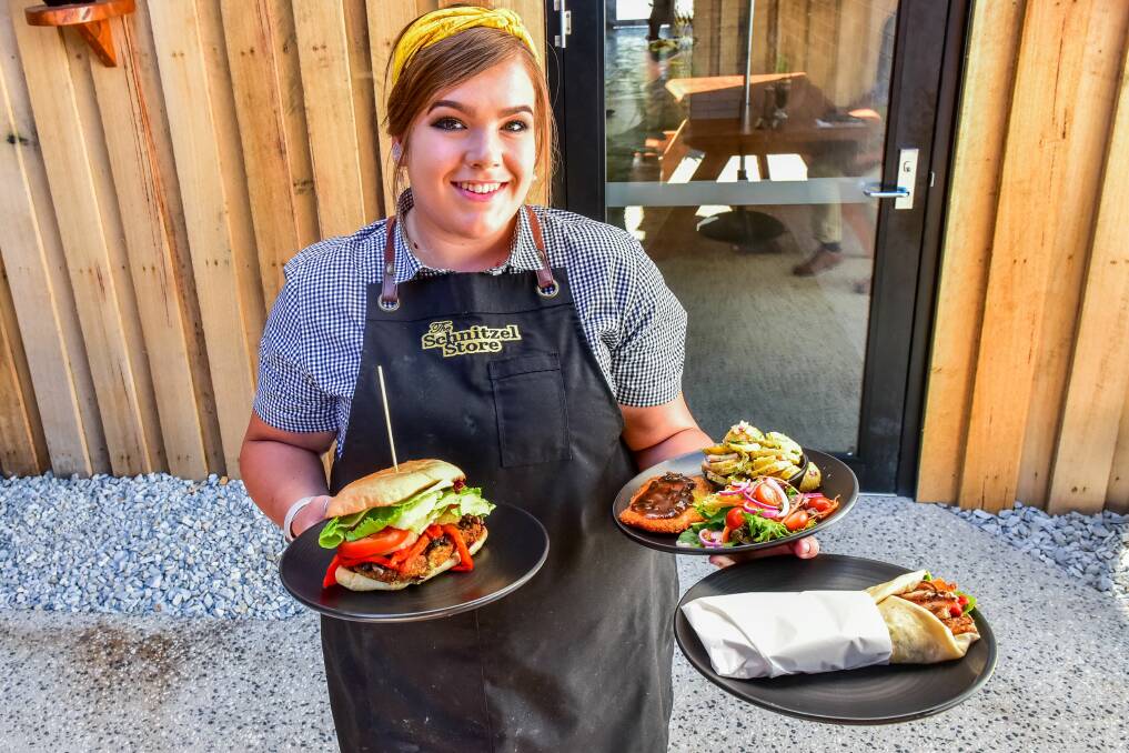 A Deutchland feast: Goldie Byrne holding a plethora of schnitzel-based cuisines at The Schnitzel Store Invermay. Picture: Neil Richardson