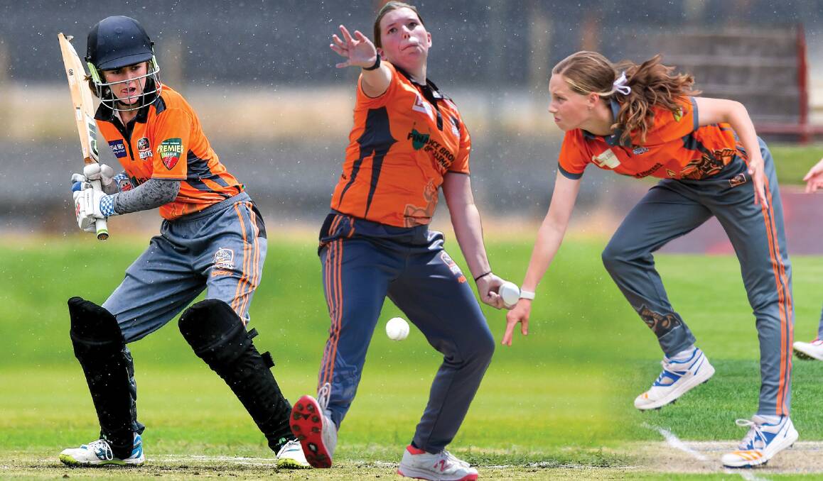 ORANGE PRIDE: Greater Northern Raiders Meg Radford, Charlotte Layton and Ava Curtis have joined the Cricket Tasmania Development Squad. Pictures: Simon Sturzaker and Paul Scambler