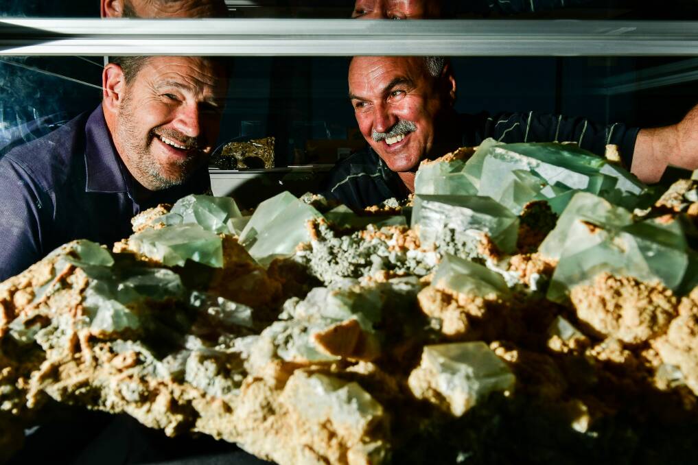GEMS: Curator David Maynard and mineralogist Andrew Tuma with the large piece of flourite and dolomite with pyrite. Picture: Scott Gelston.