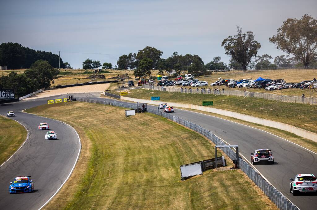 TCR racers handling the famous Symmons Plains hairpin in front of an eager crowd at the famous circuit. 