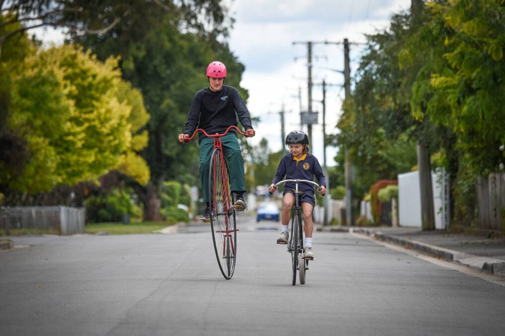 Top gear: Tom Thompson 14  and  Marguerite McClintock 11 gearing up for the Evandale Village Fair and National Penny Farthing Championships. Pictures: Paul Scambler. 
﻿