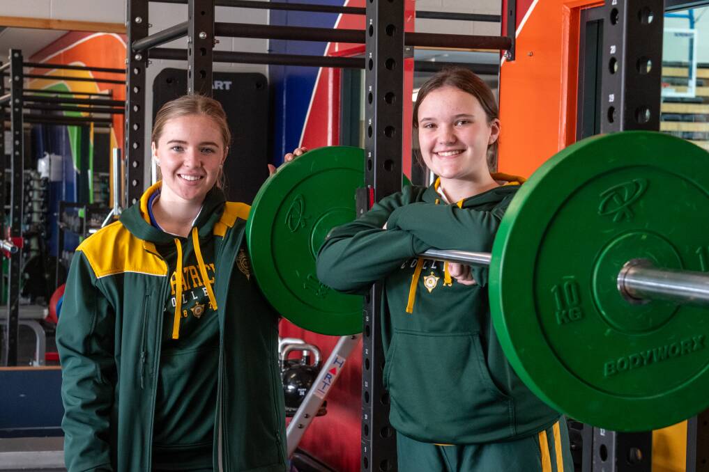 STRENGTH: St Patricks weightlifters Adeline-Jane Richardson and Jorja Love are ready to represent Tasmania this weekend. Picture: Paul Scambler