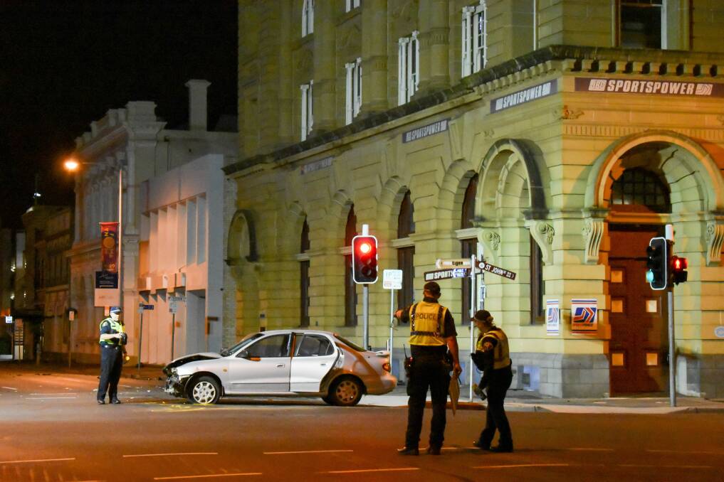 Tasmania Police officers attending the Paterson Street crash. Picture: Tarlia Jordan