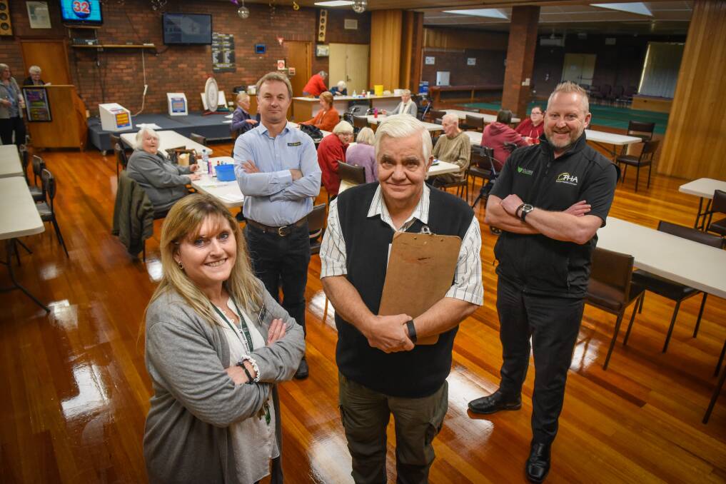 Lights on: Ravenswood Over 50s Club manager Karen Jacobs and president Nik Djonlija with Energy ROI director Duncan Livingston and Tasmanian Hospitality Association project manager Andrew Moore at the Ravenswood Over 50s Club. Picture: Paul Scambler
