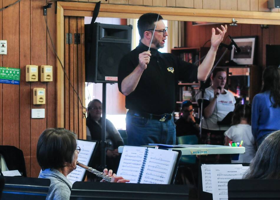 Practice makes perfect: Musical director Darren Papworth leading concert rehearsals. Picture: Neil Richardson