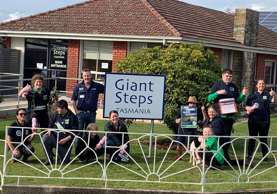 Thumbs-up: Giant Steps students and staff including teacher Danielle Whatley with Rural Youth Tasmania Agfest chairman Ethan Williams. Picture: supplied