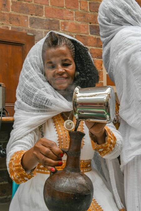 Saba Gebrihewet makes the coffee, during the Eritrean & Ethiopan Coffee ceremony at the Pilgrim Uniting Church. Picture: Paul Scambler