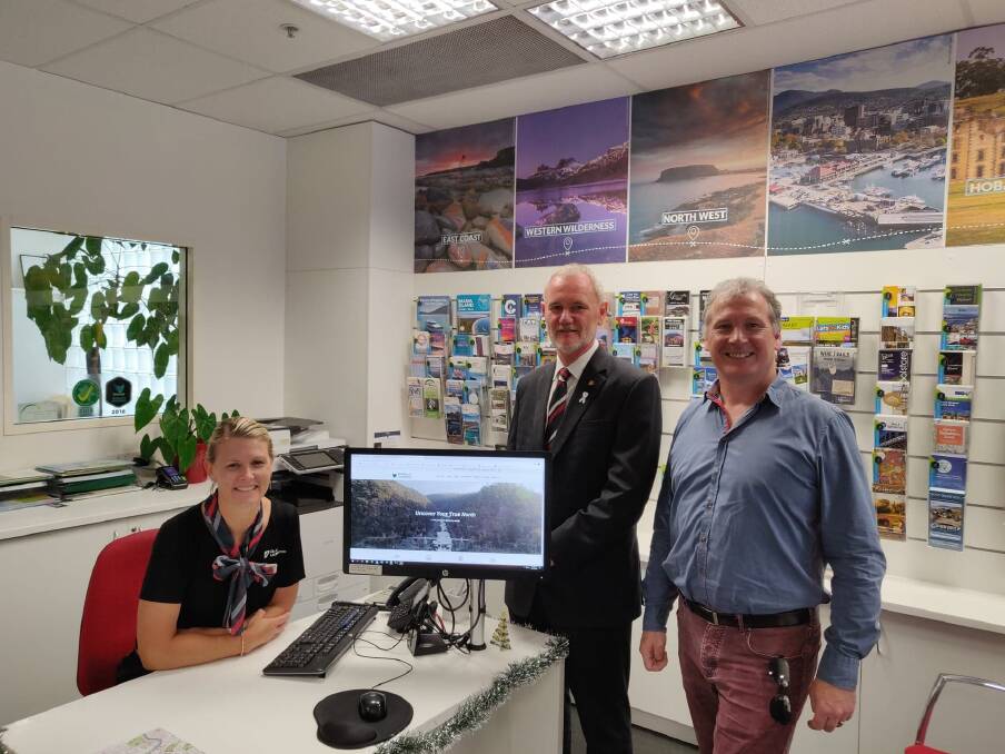 Access granted: Yvette Harmey with Albert van Zetten and Chris Griffin checking out the new website. Picture: Harry Murtough