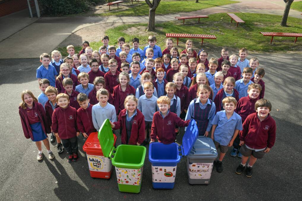 Fighting waste: Grade 2 Riverside Primary students, with the recycling bins are Archie Bellinger, 7. Grace Howard, 7, Cohen Niekamp, 8, and Cindy Mundy, 8, Riverside Primary. Picture: Paul Scambler.