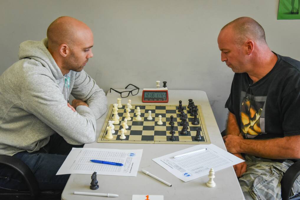 Checkmate: Grandmaster David Smerdon of Queensland against Launceston Chess Club president Kerry Beeton. Picture: Paul Scambler