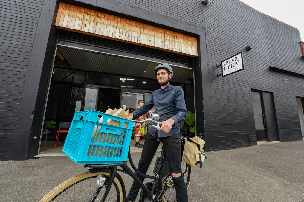 Delivering the goods: Bread and Butter's Xavier Sherrin, on a delivery bike donated by a cafe regular. Picture: Paul Scambler