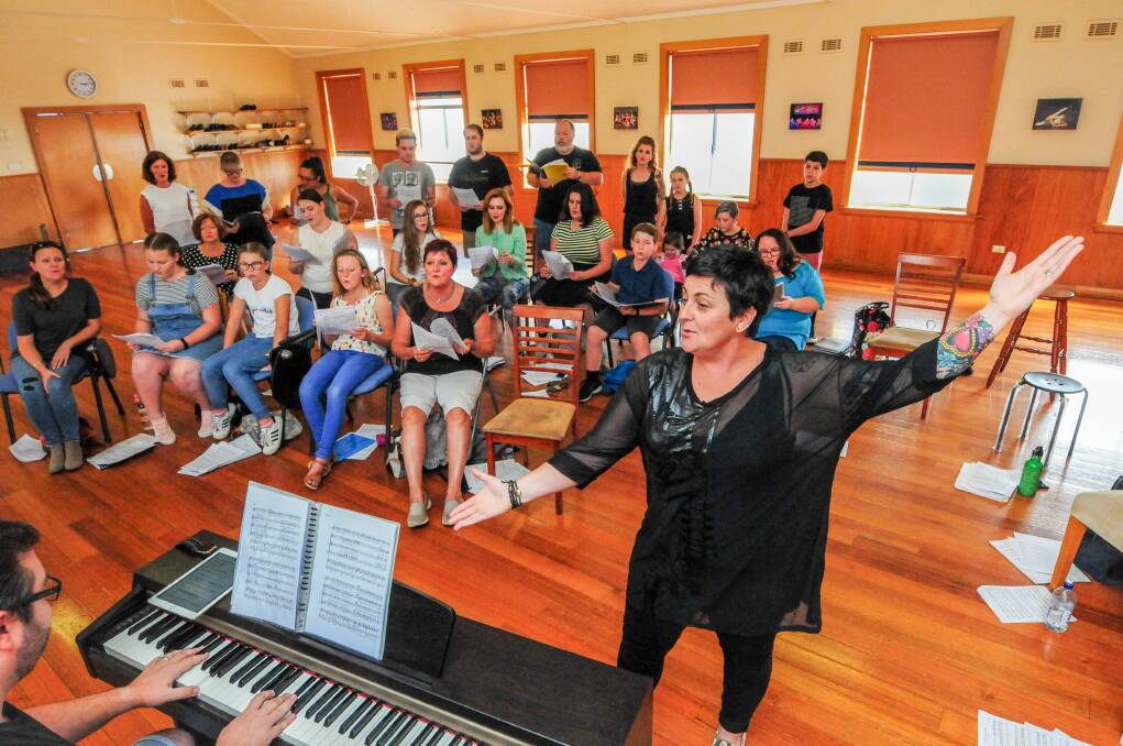 Community chorus: Jade Howard music director Andy Prideaux and singing ensemble from Launceston Music Society rehearsing for their upcoming showcase. Picture: Paul Scambler