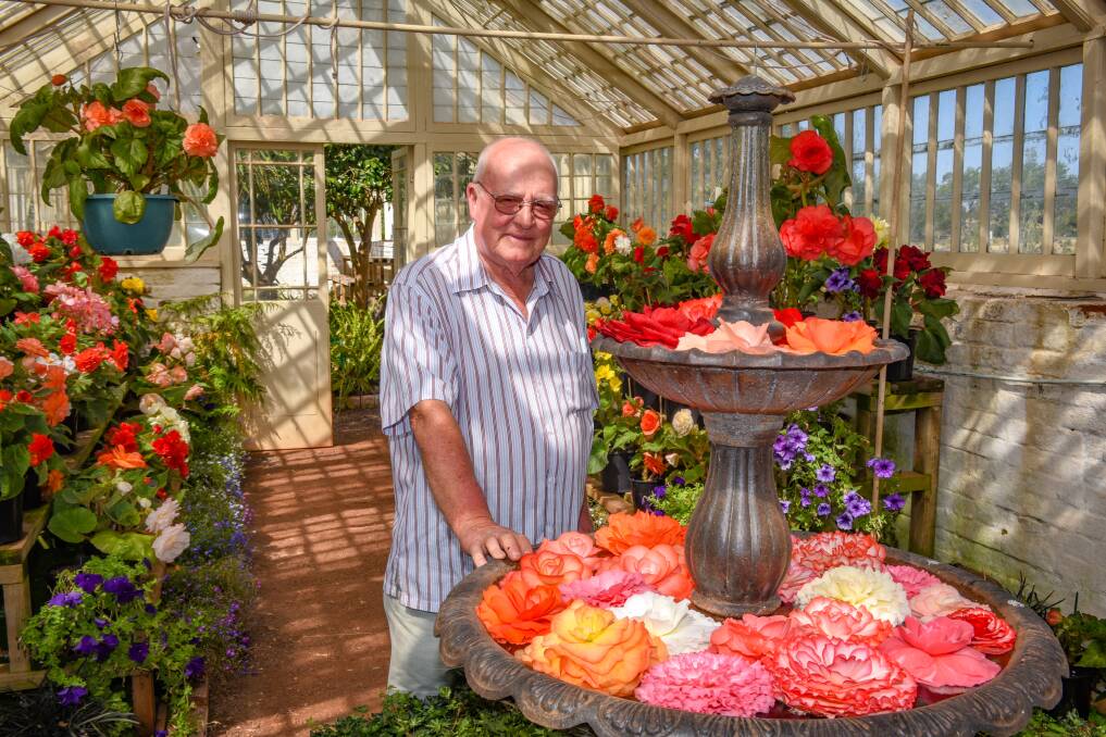 Vibrant: Peter Bugg with a fountain full of begonias. Picture: Paul Scambler